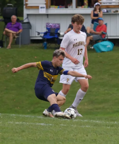 Ike girls win, boys fall in soccer